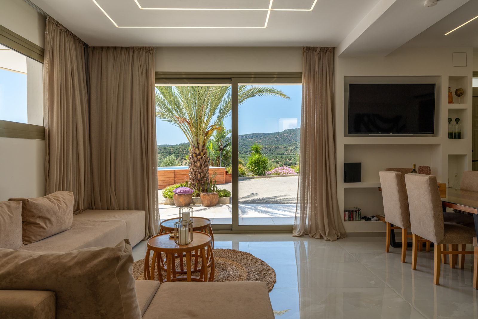 Open-plan living room opening onto the pool terrace